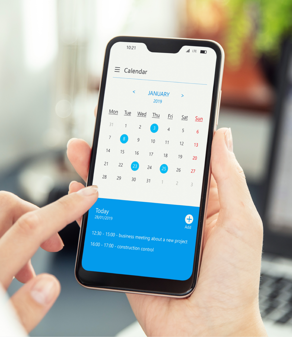 Checking calendar on phone to check the availability to book an appointment with dentist.